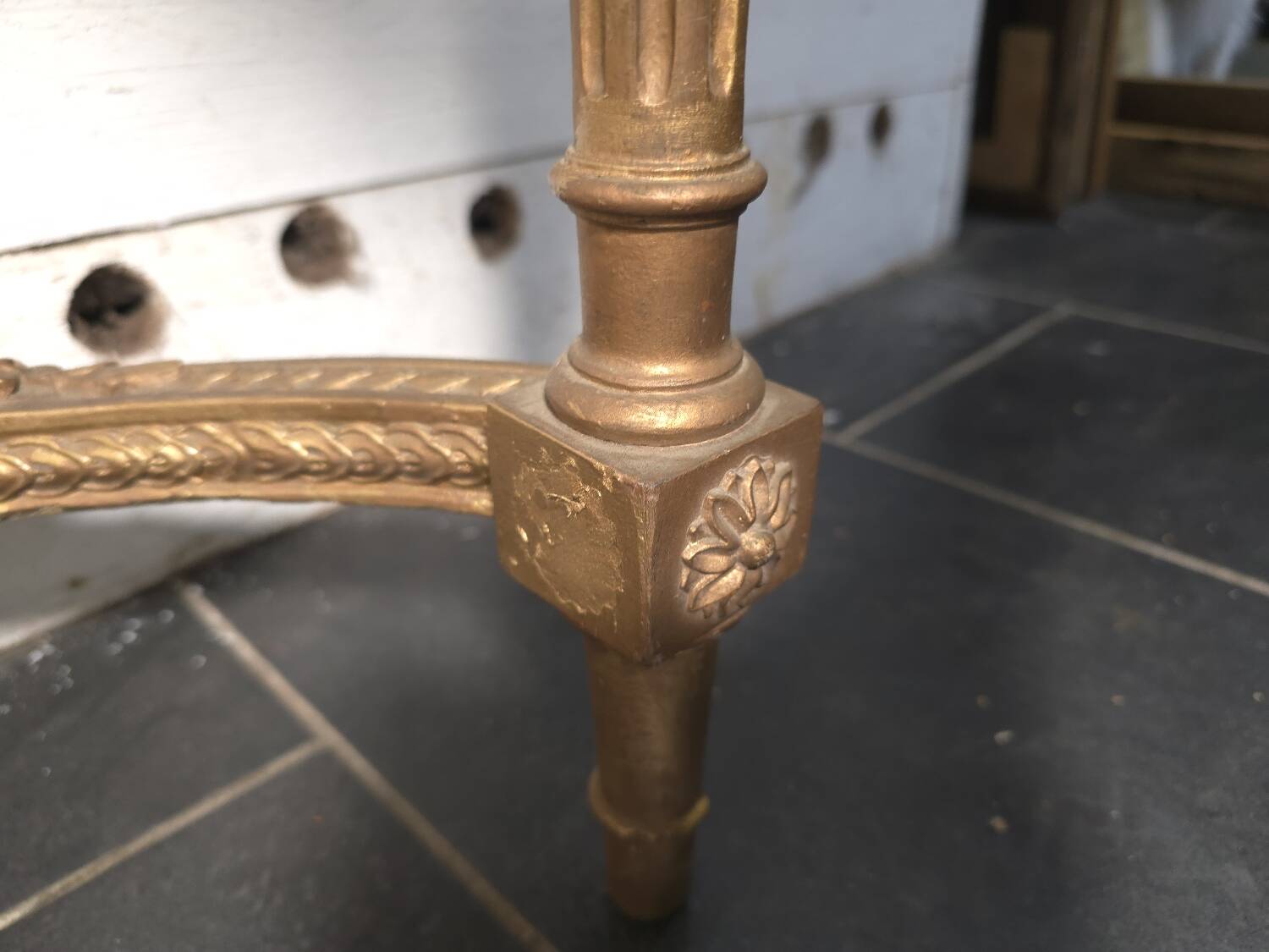 Louis XVI style console in gilded wood with a marble top.