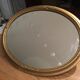 Miroir ovale en bois doré 67x47cm