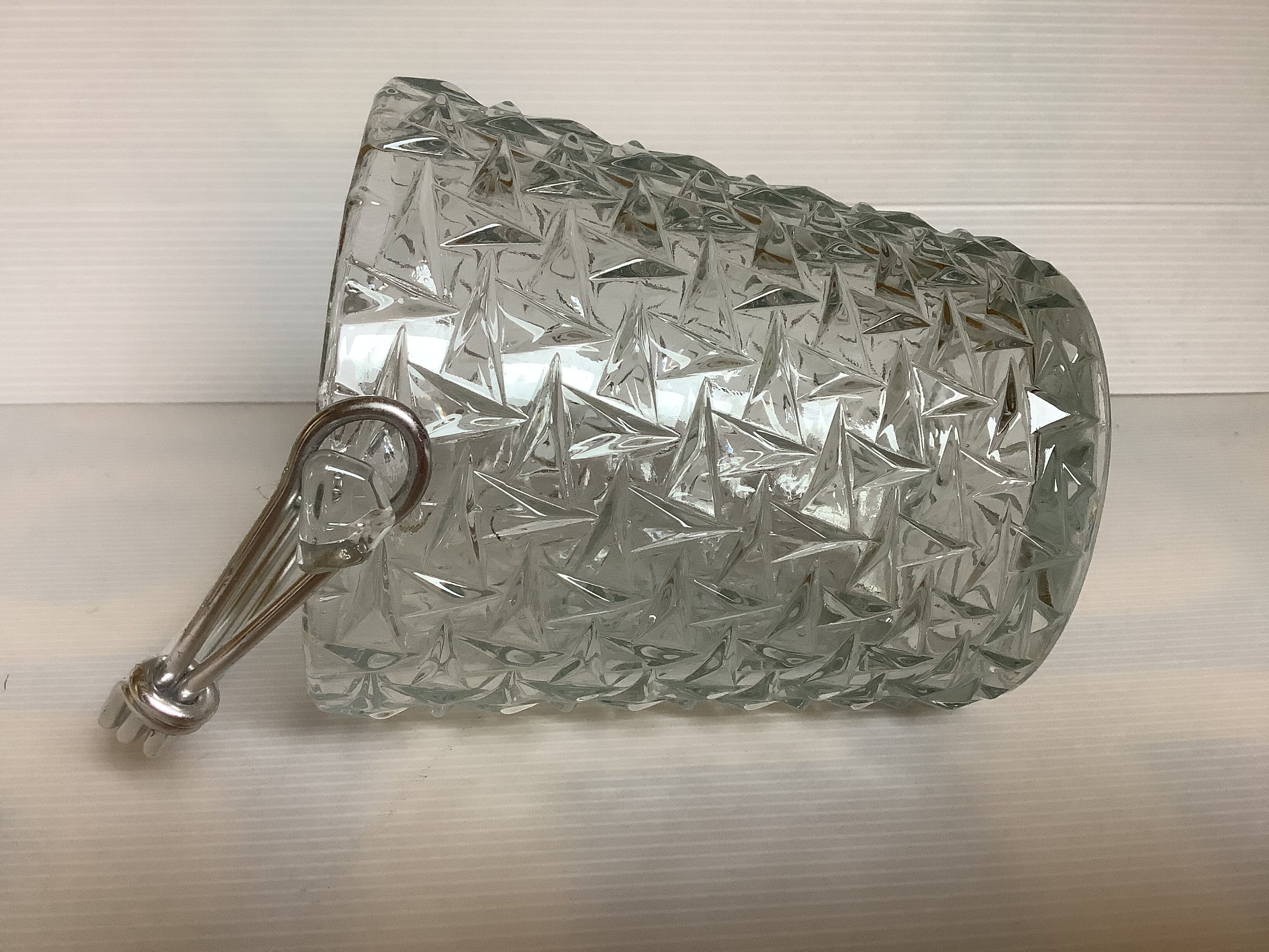 Geometric triangle patterned ice bucket in glass.