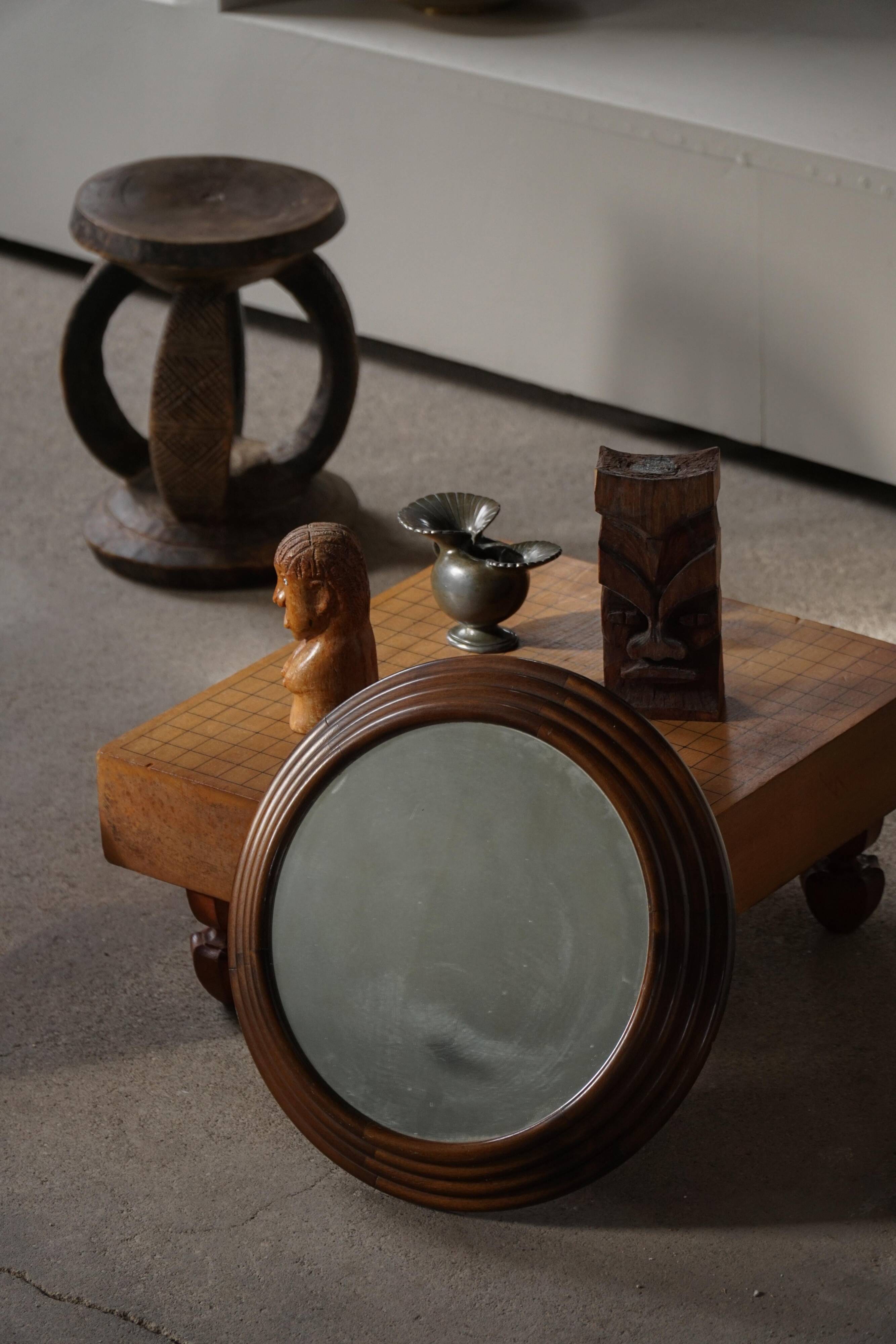 Round wooden wall decorative mirror, carved frame, mid-20th century, 1950s.