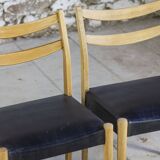 Pair of Scandinavian chairs in teak and faux leather, 1960.