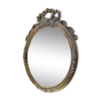 Miroir ovale doré style Louis XVI