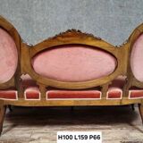 Very large Louis XV style mahogany banquette with medallions from the 19th century.