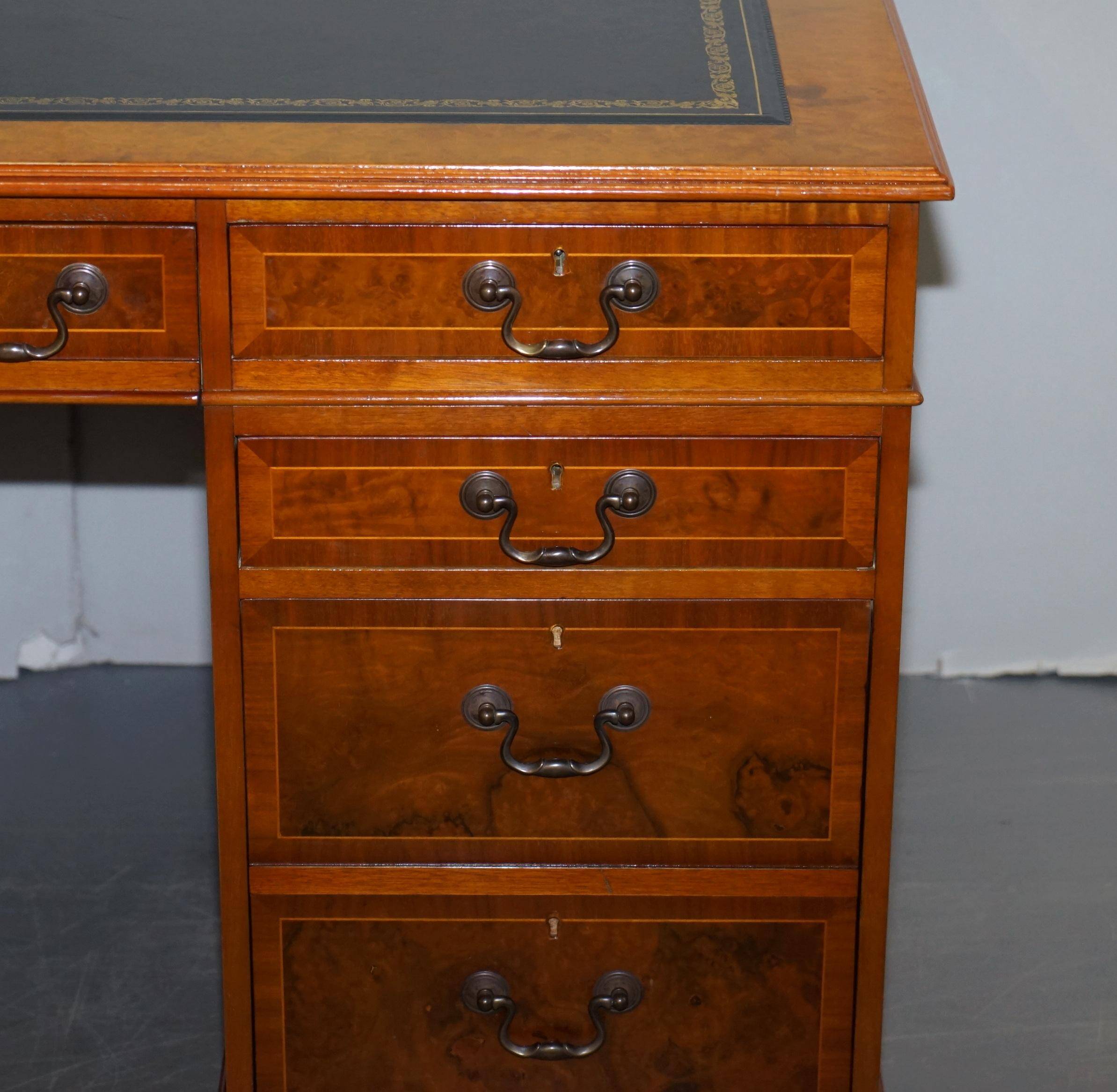 Partner desk in burr walnut designed to conceal computer equipment.