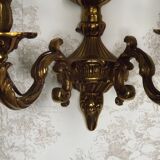 Pair of French baroque brass wall sconces with two branches, decorated with acanthus and wickerwork.