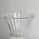 Antique thick glass vase on a pedestal.