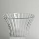 Antique thick glass vase on a pedestal.