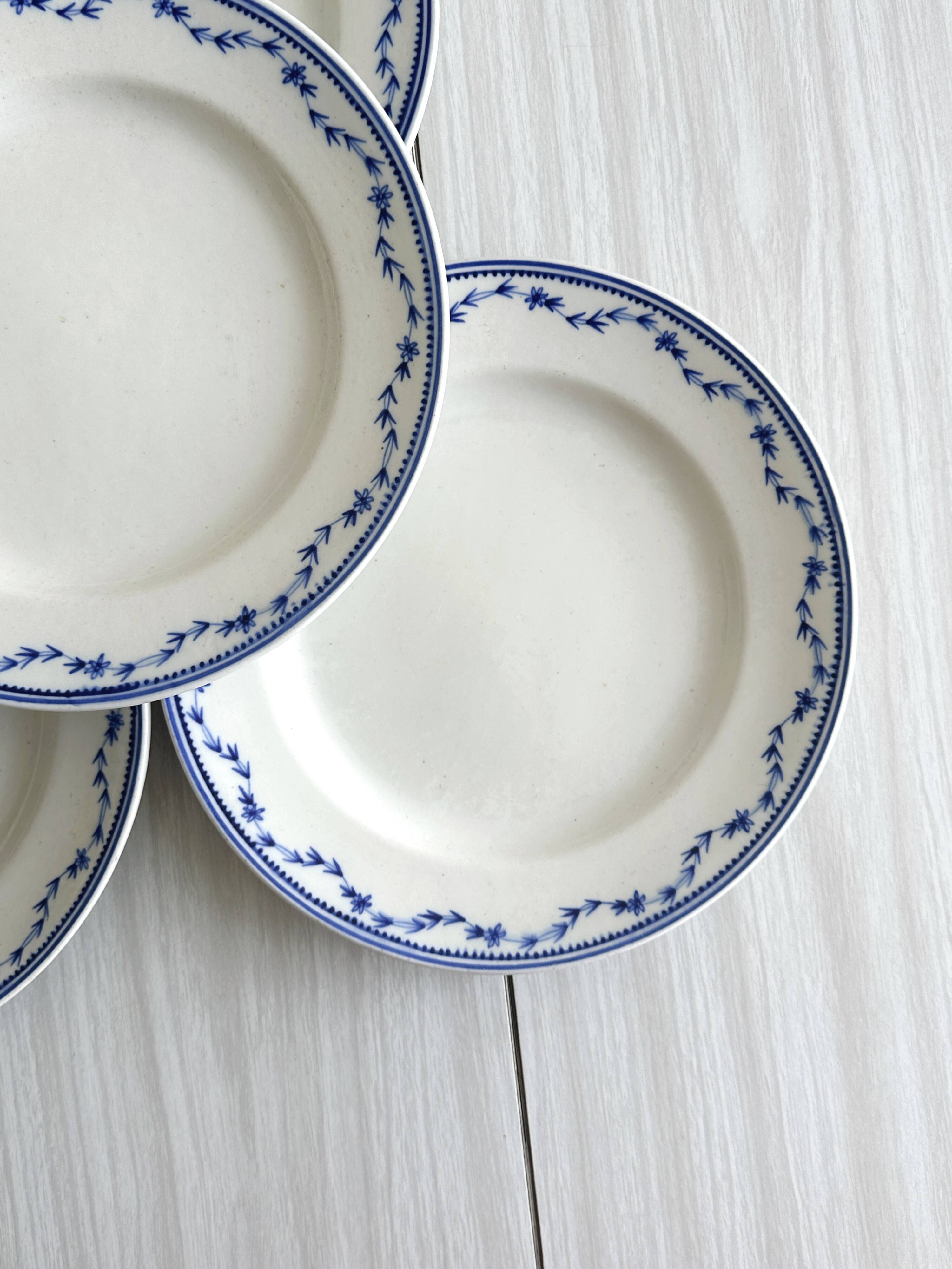 4 antique ceramic plates with blue flowers