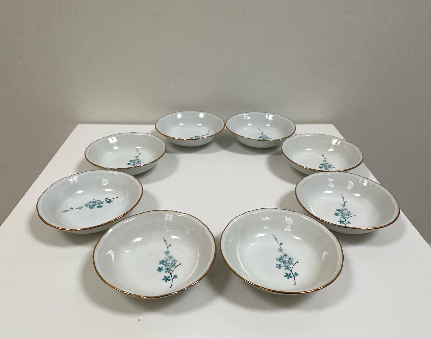 Vintage porcelain service: salad bowl and 8 small bowls.