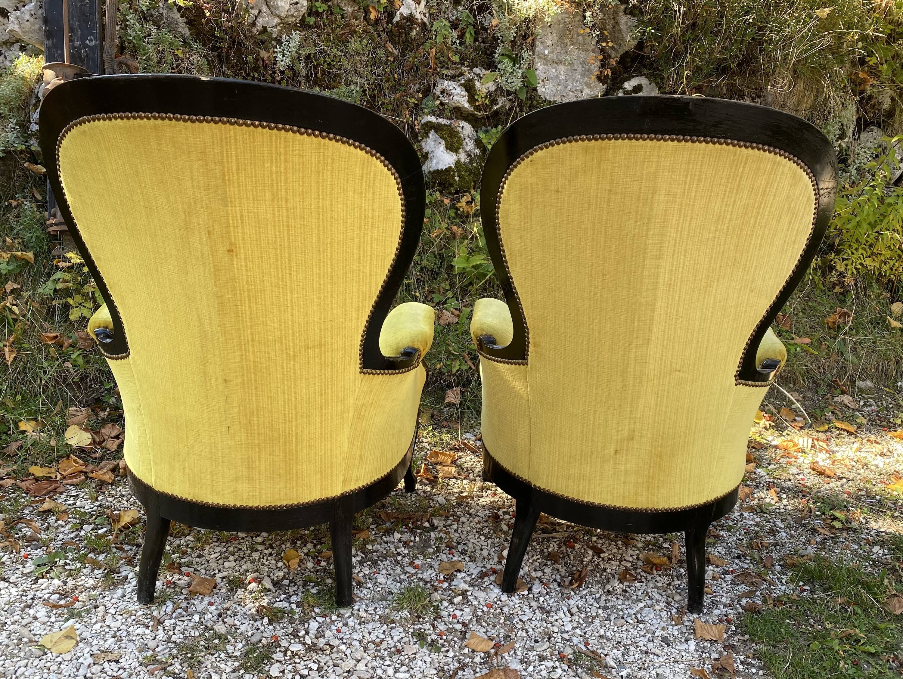 Pair of 19th century armchairs in black lacquered wood