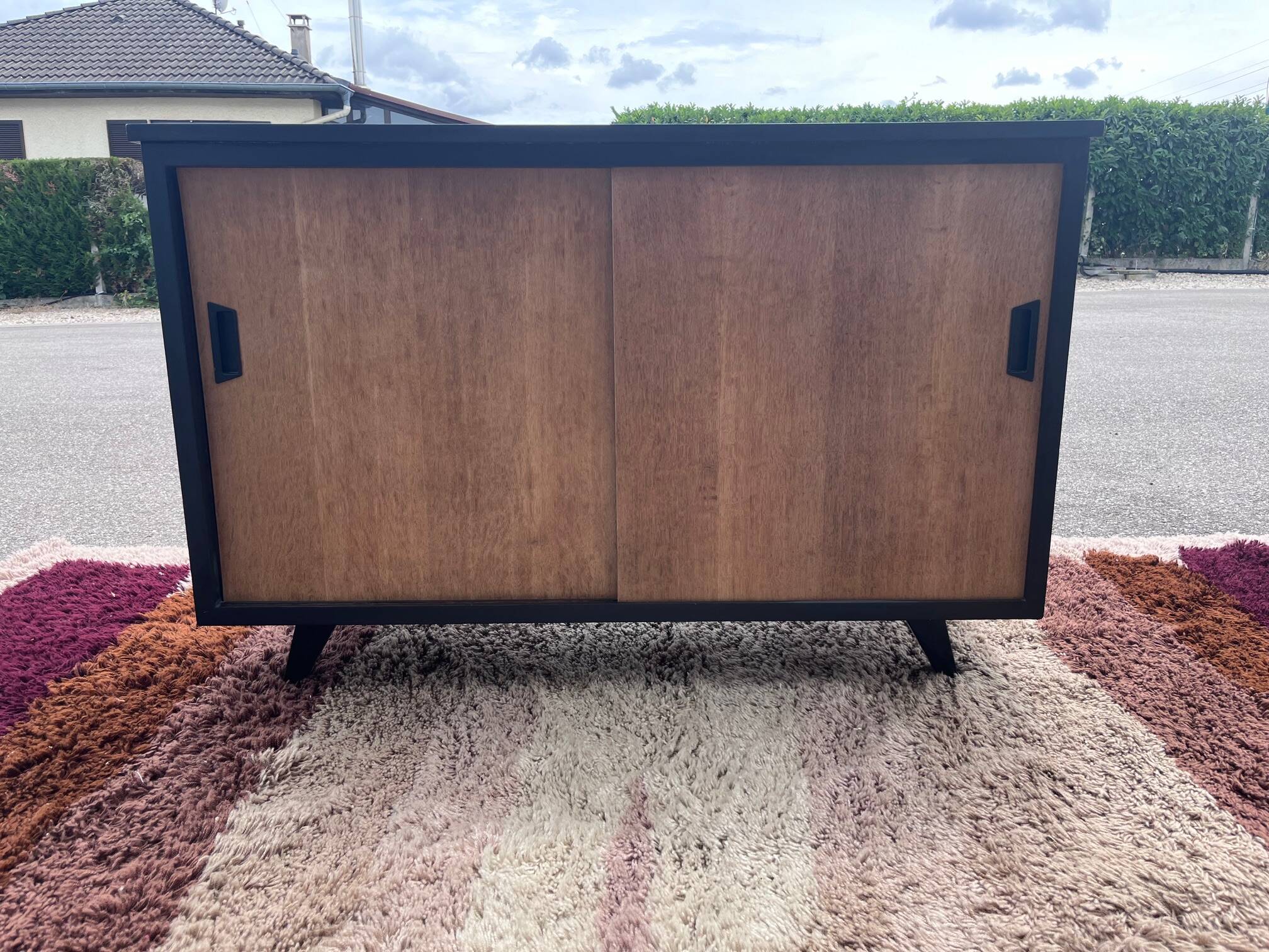 black and wood two-door sideboard