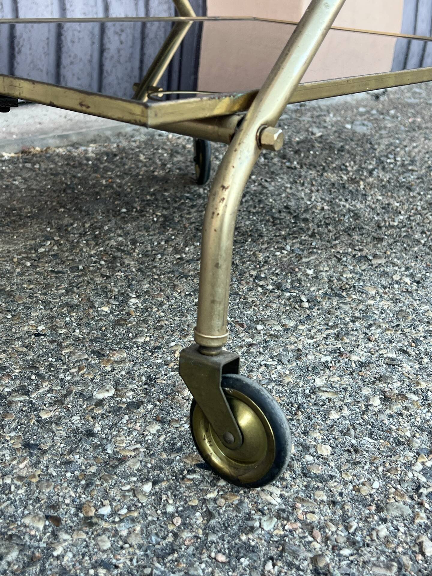 Vintage gold dessert bar with two black trays.