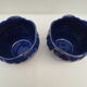 Pair of cache-old pots in midnight blue and gold ceramic