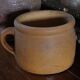 Round terracotta milk jug with handle