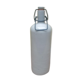 Old bottle in enamelled beige sandstone at the beginning of the 20th century