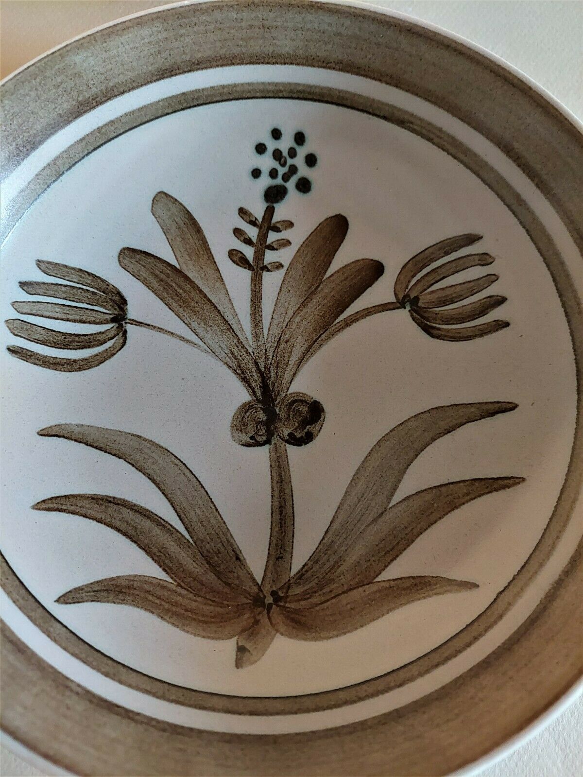 Vintage hollow plates in sandstone series of four marked Longchamp