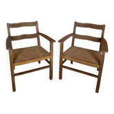 Pair of country armchairs in solid wood with corded seats.