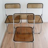 Trio of plexiglass folding chairs