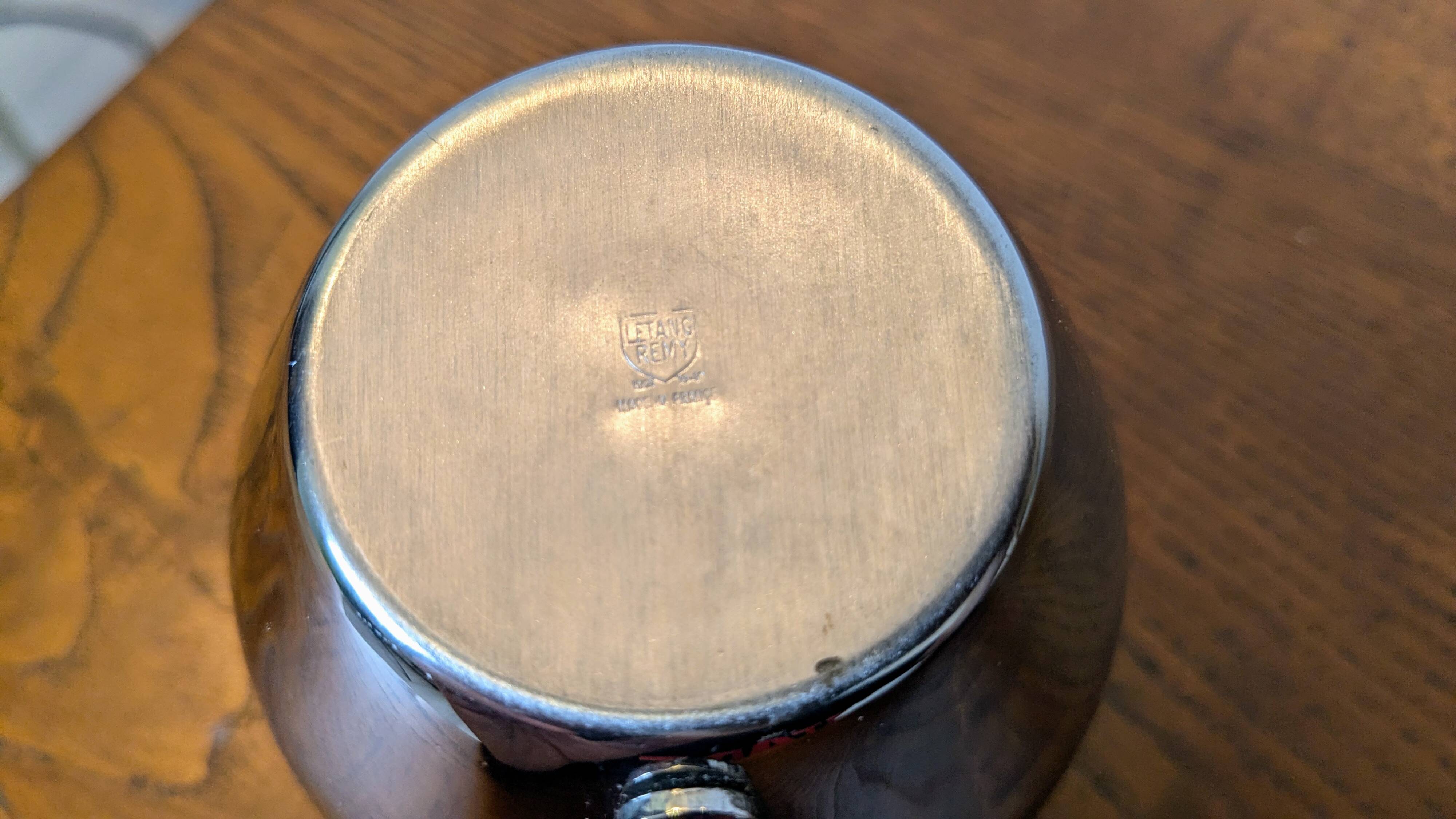 Antique stainless steel milk jug by Remy Letang