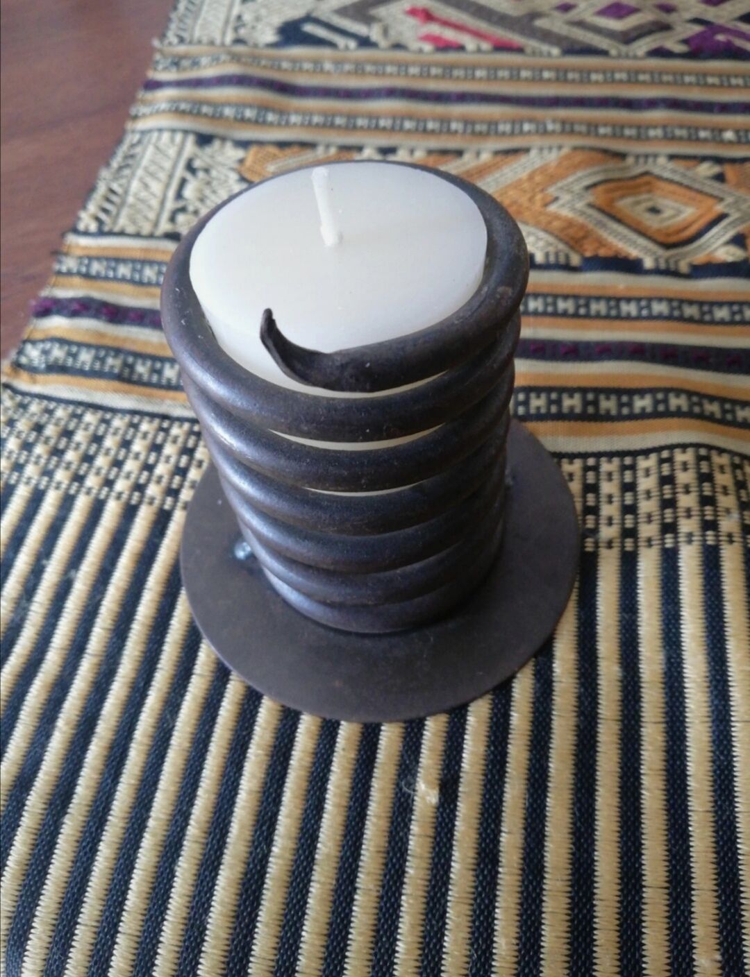 Spiral metal candle holder spring with candle, bronze appearance