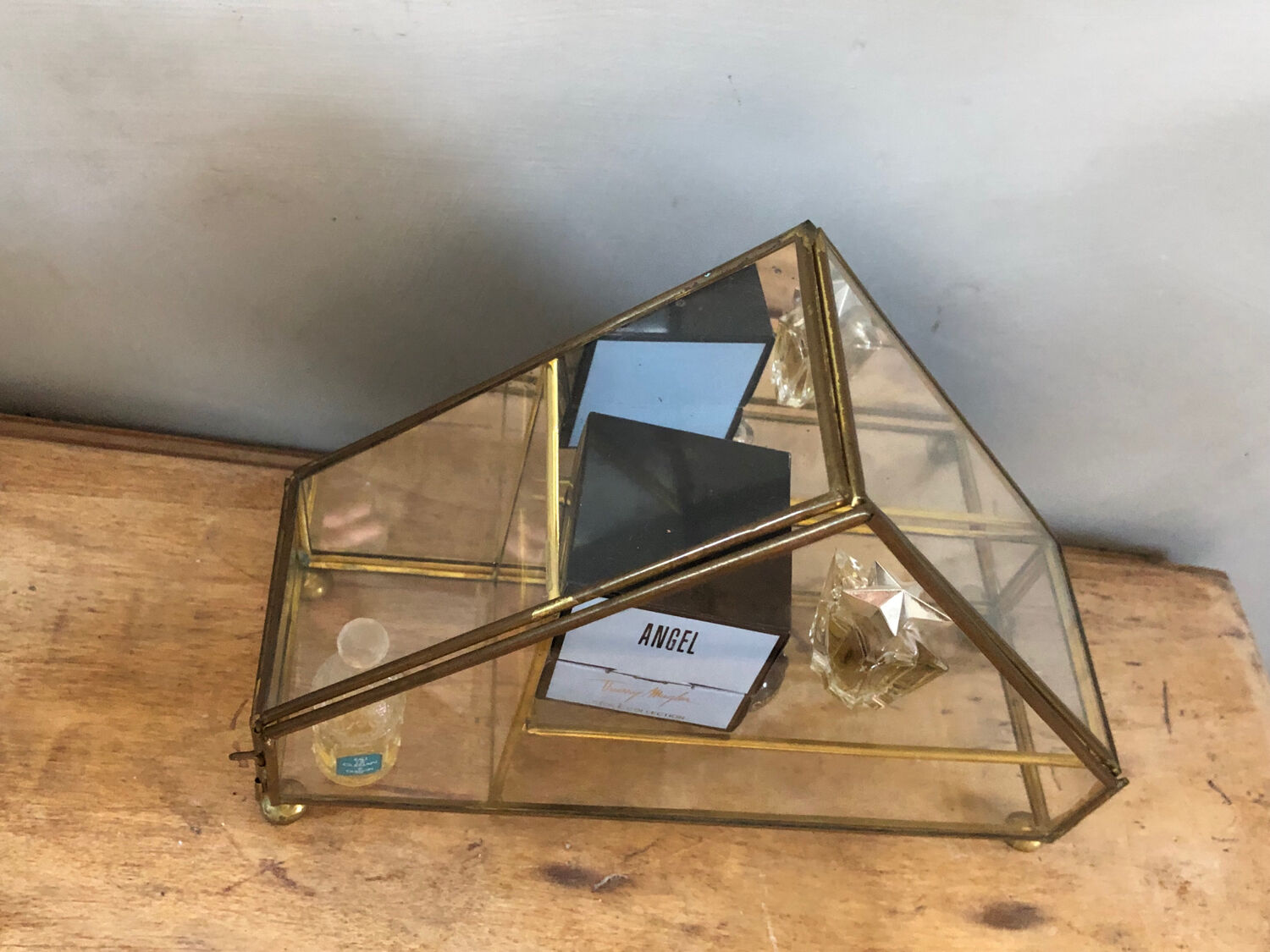 Vintage showcase, glass and brass for collectibles.