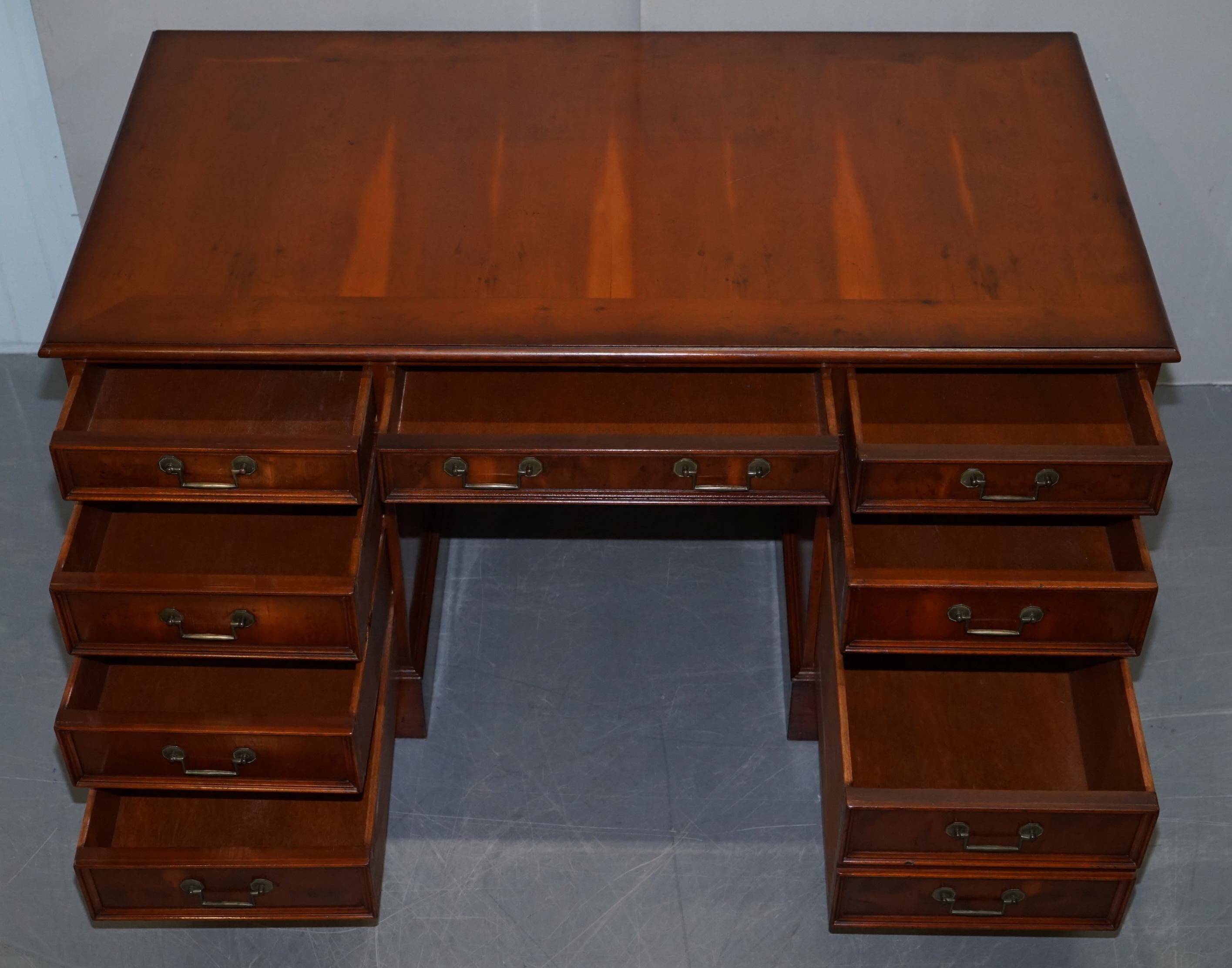 Partner desk with double pedestal in burr yew wood with decorated top.
