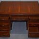 Partner desk with double pedestal in burr yew wood with decorated top.