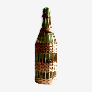 Glass bottle covered with wicker, France of the 60