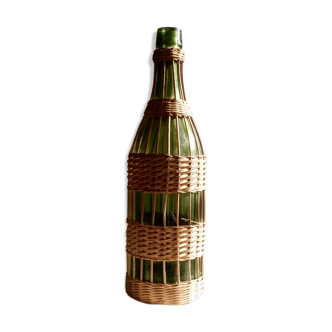 Glass bottle covered with wicker, France of the 60