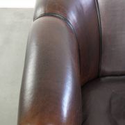 Dark sheepskin club armchair with unique design in English style