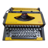 Machine à écrire vintage 1970s aeg olympia traveller de luxe jaune