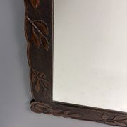 Arts & Crafts hand-carved wall mirror with floral roses, early 20th century