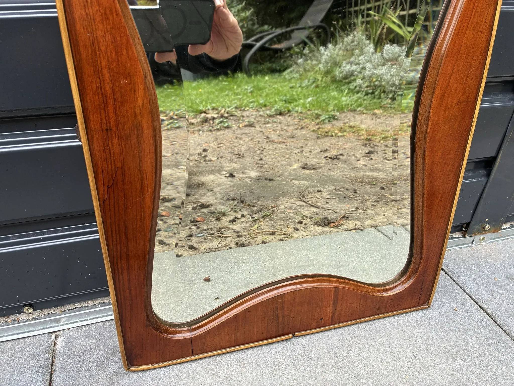 Mid-century organic shaped bevelled mirror in wooden frame, 1940s-50s
