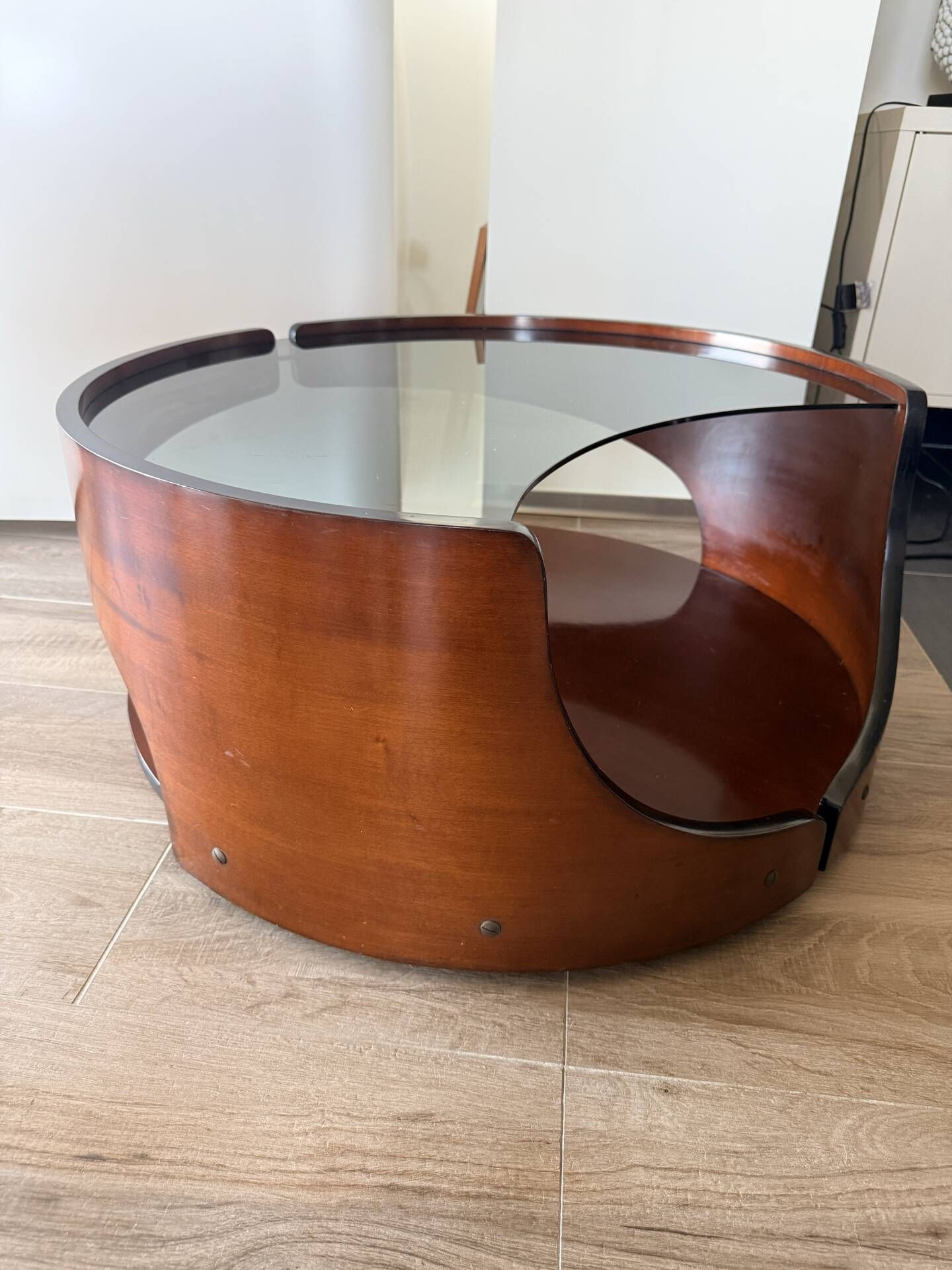 Italian Space Age coffee table in curved wood and smoked glass – 1970s