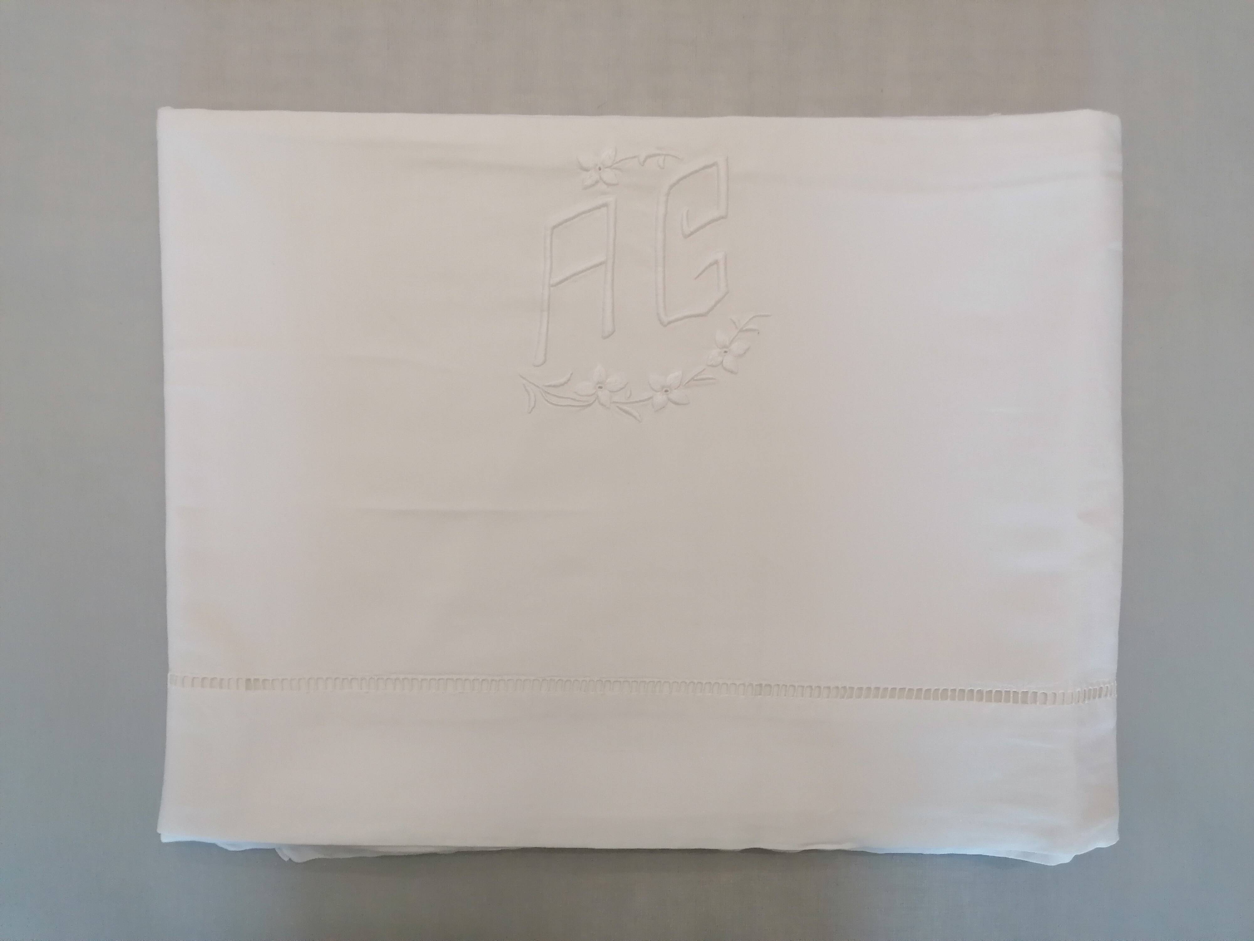 Antique white flat sheet embroidered with “AG”