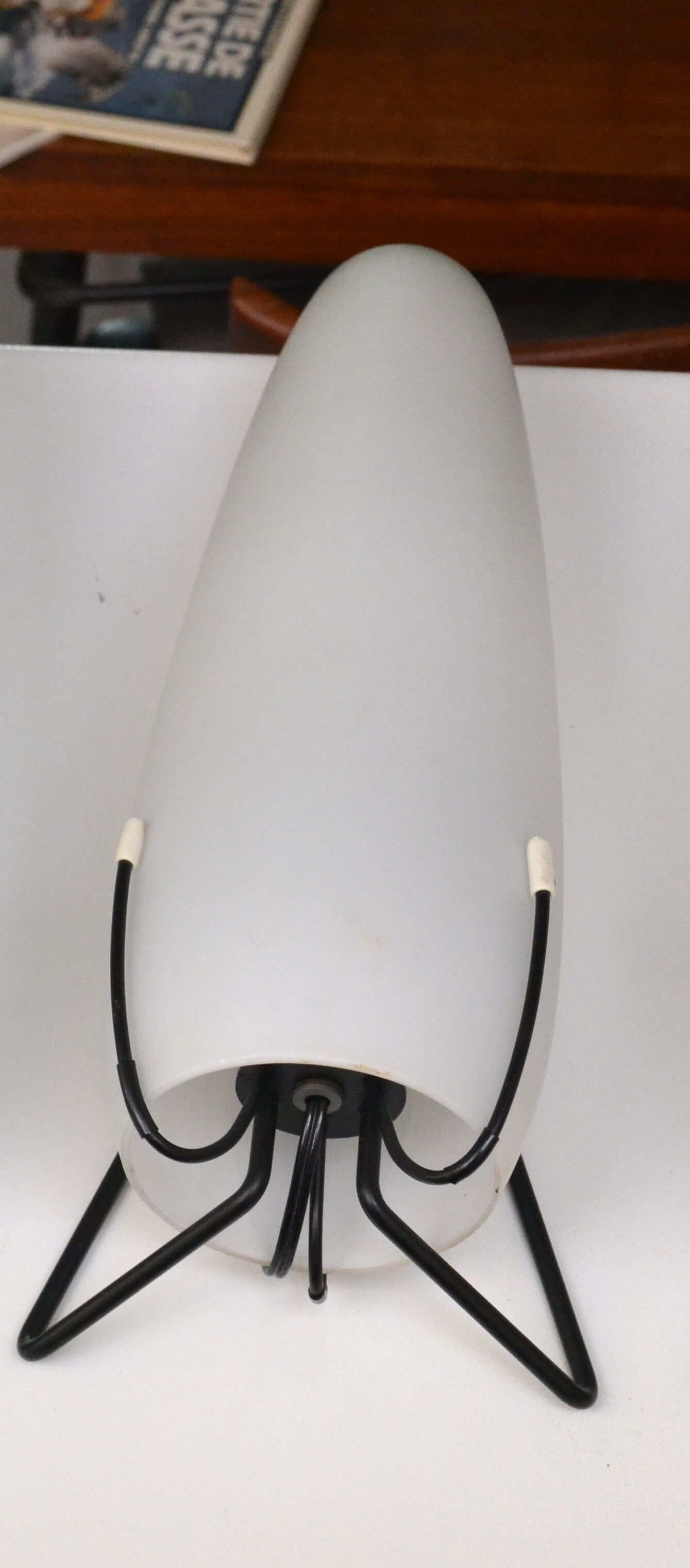 Louis Kalff opaline and metal wall light from the 1950s.