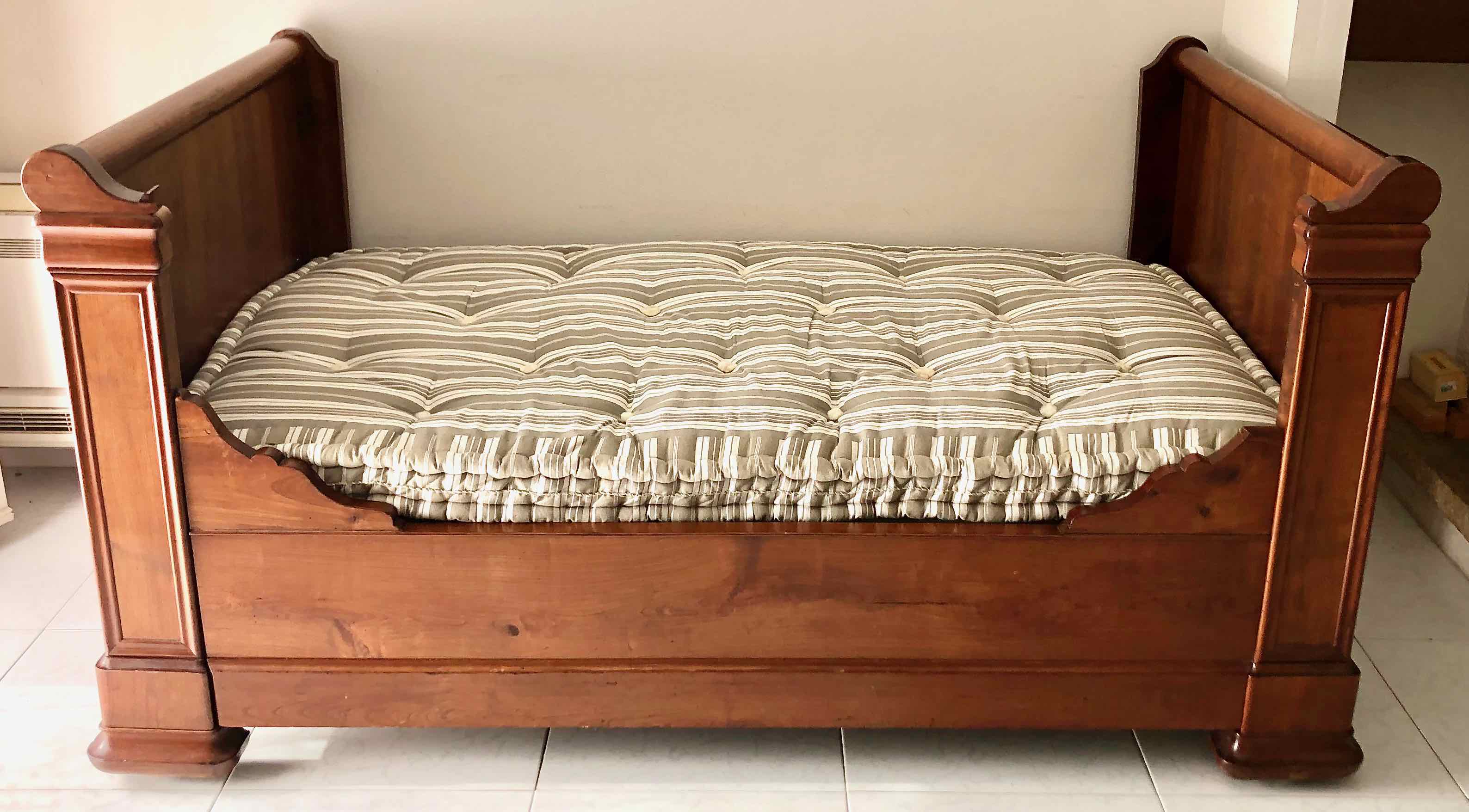 Cherry wood boat bed with bedding