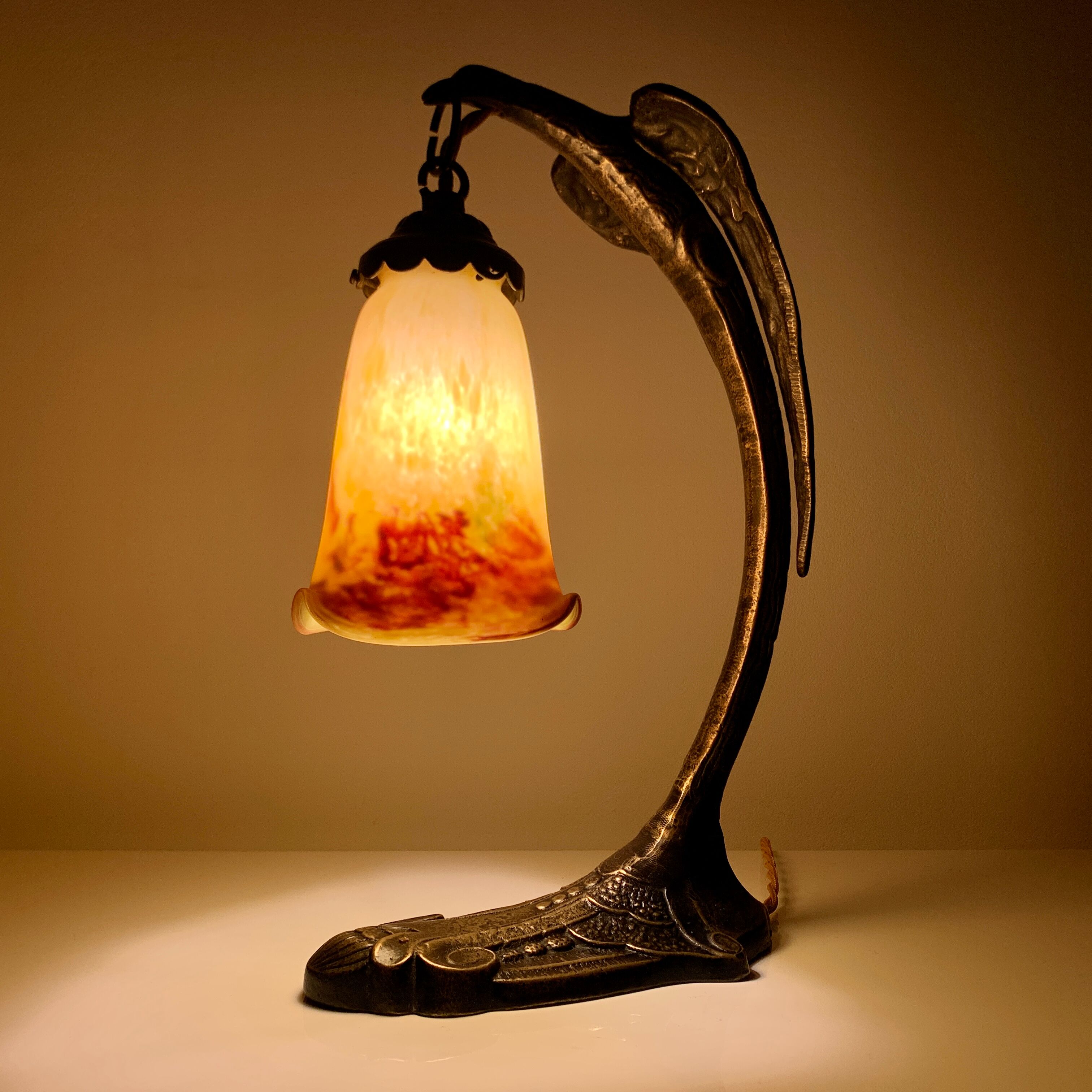 Bronze eagle lamp patinated and Art Nouveau style glass pate