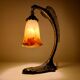 Bronze eagle lamp patinated and Art Nouveau style glass pate