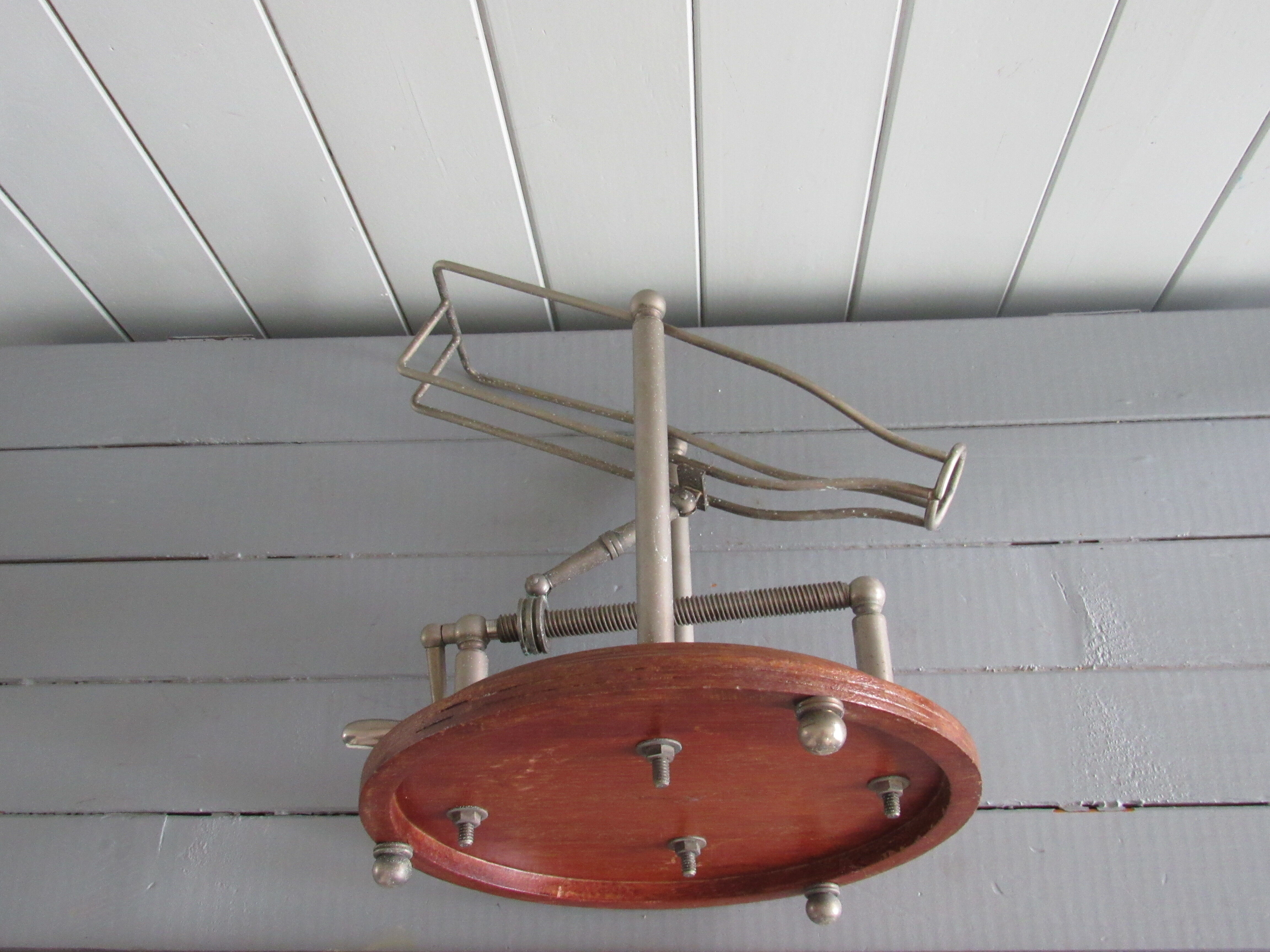 Old mechanical wine decanter on wooden base