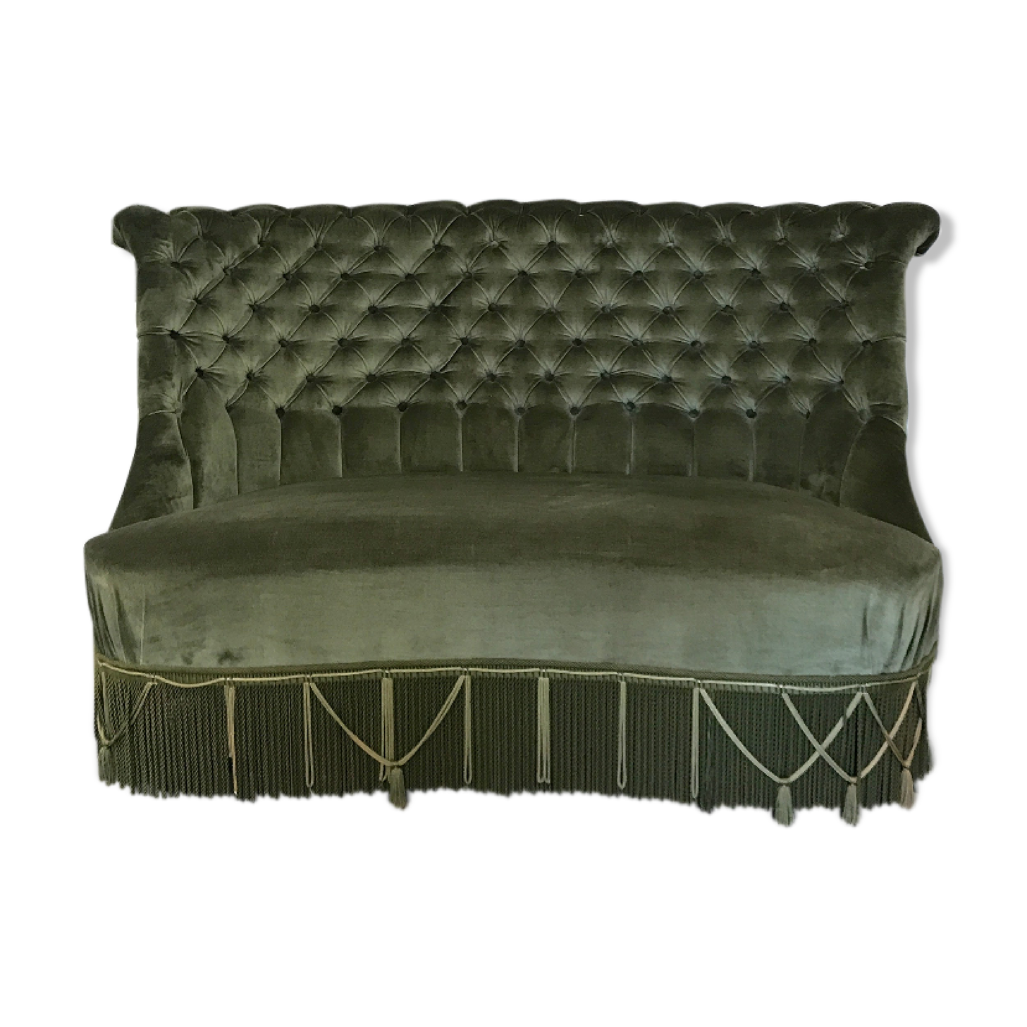 Toad in green velvet sofa