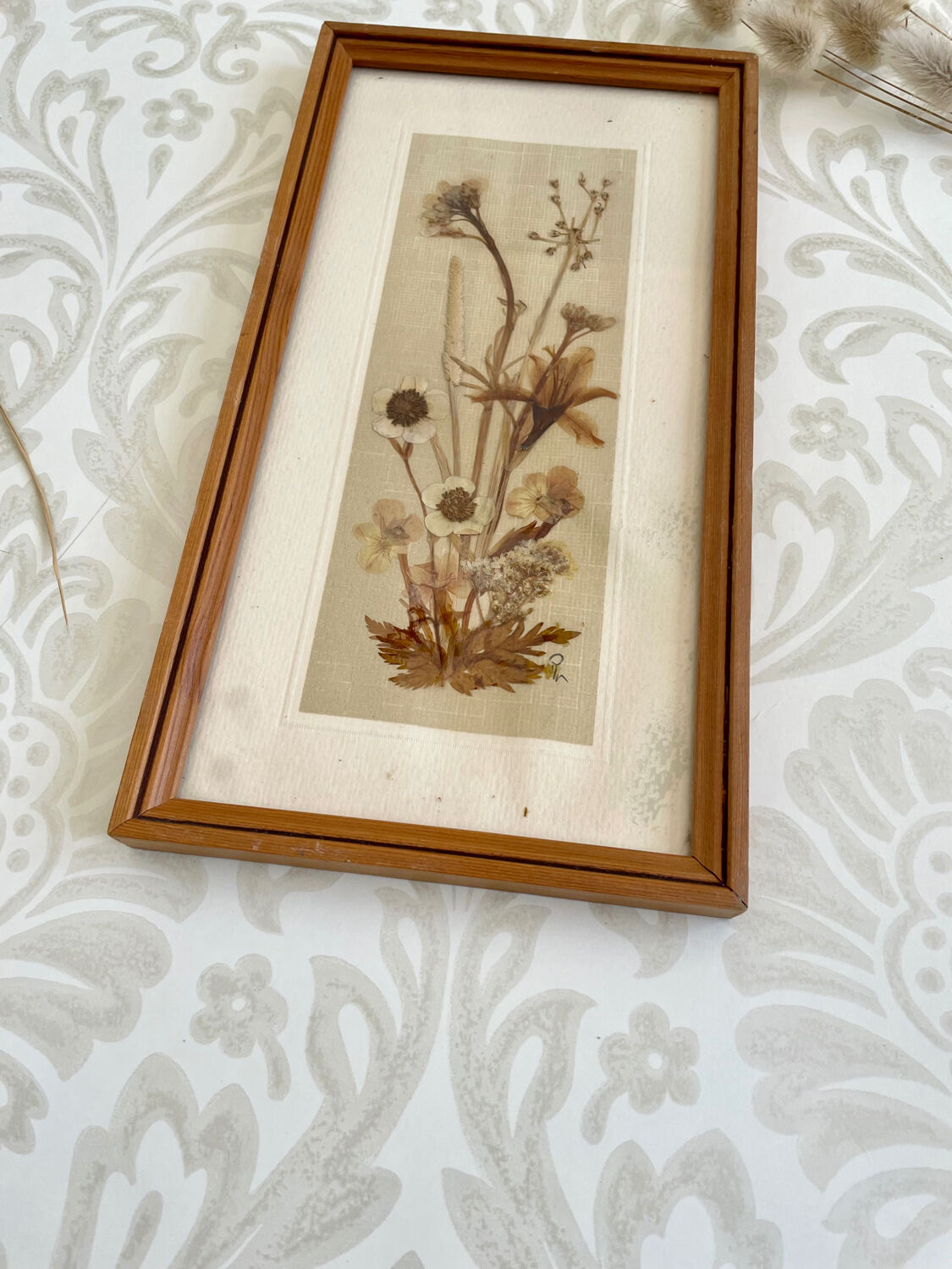 Vintage wood frame dried flowers under glass