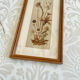 Vintage wood frame dried flowers under glass