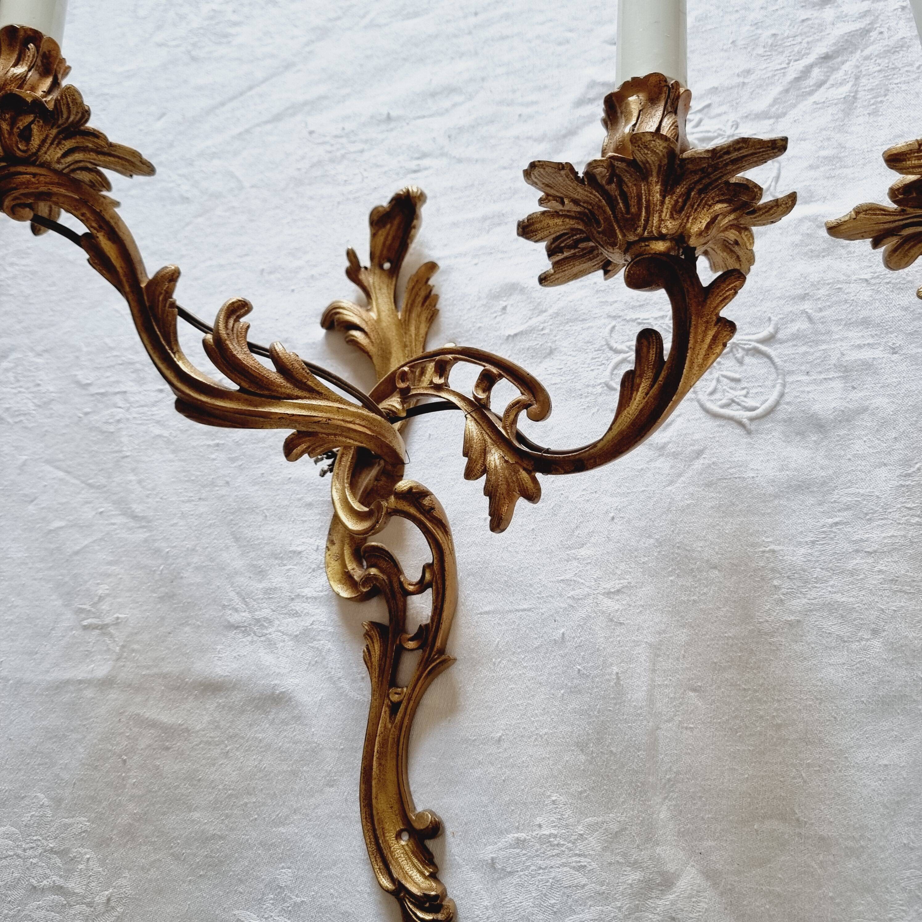 Pair of vintage French wall sconces in bronze, Louis XV Rococo style.
