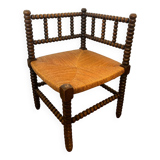 Corner chair in turned wood and straw