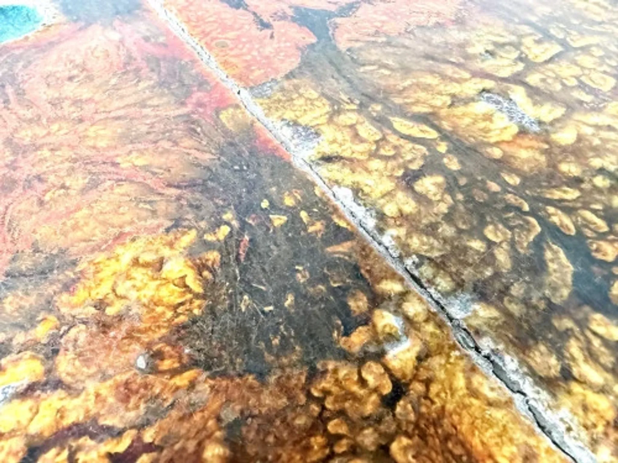 Coffee table by Robert and Jean Cloutier in enamelled lava and metal, 1950s.