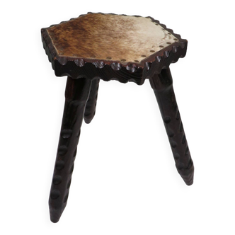 Vintage Spanish stool in carved wood with a leather seat.