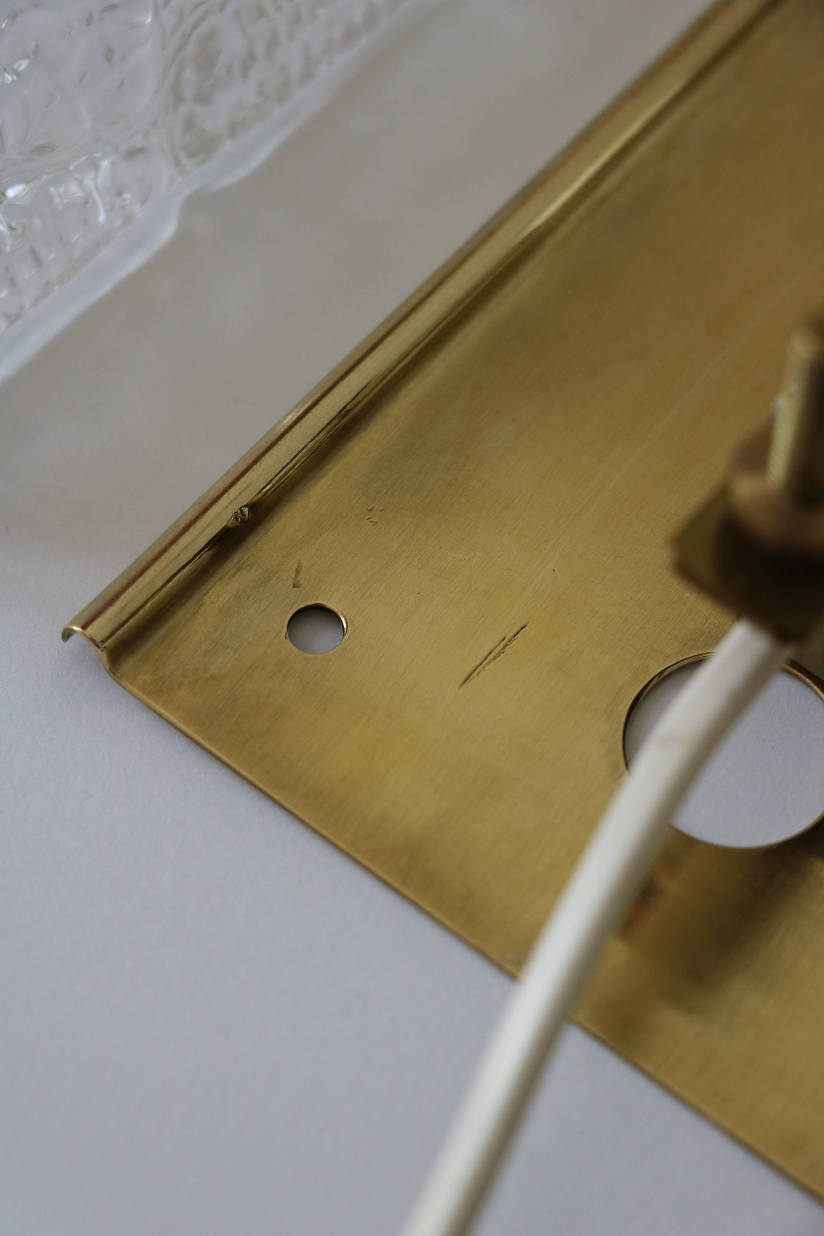 Pair of glass and brass wall lights by Carl Fagerlund for Orrefors.
