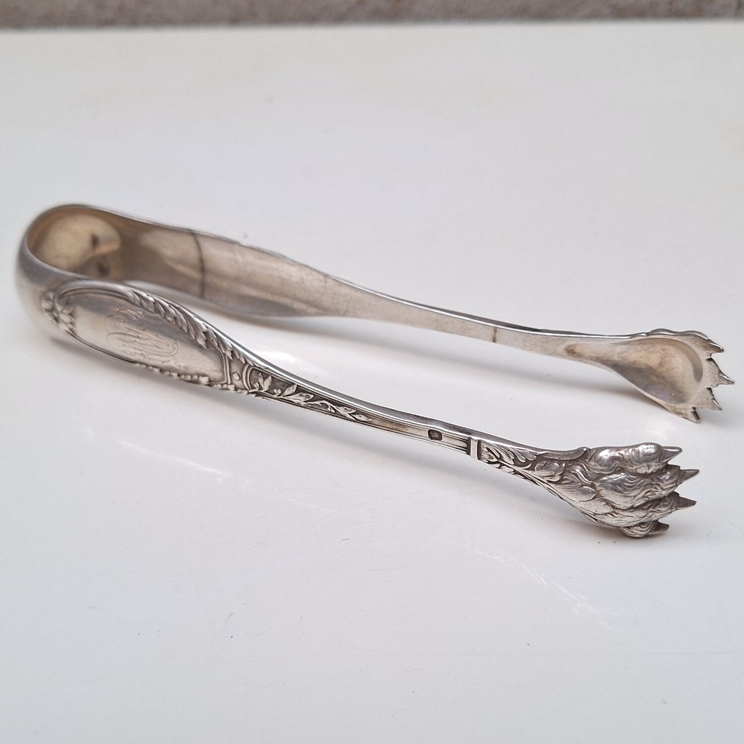 Solid silver sugar or ice tongs with lion's paw decoration