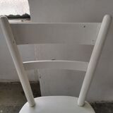 Set of 6 mismatched white chairs